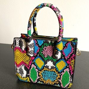 Rainbow, snake printed mini handbag with a chain to become a cross body.